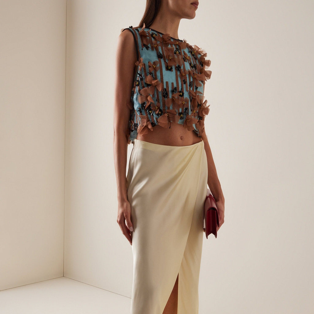 Sleeveless top with blue striped appliqués