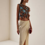 Sleeveless top with blue striped appliqués